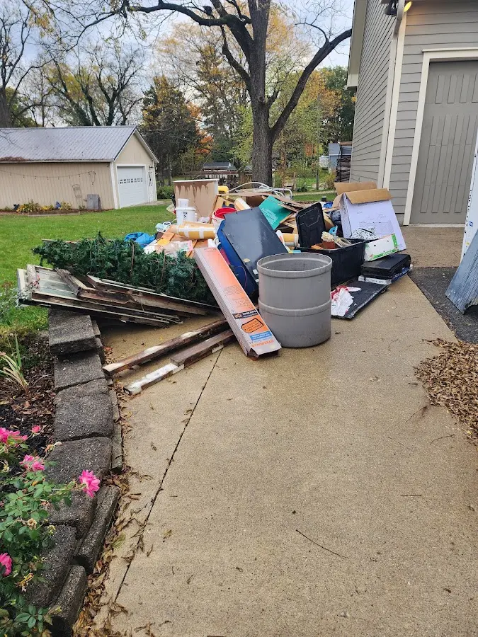 Dumpster being loaded with debris for Residential Dumpster Rental in Exeter